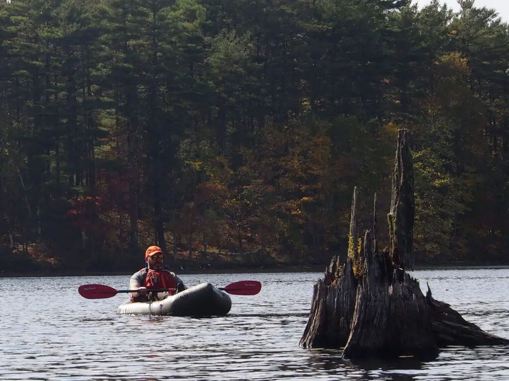 Jeff on his packraft at Lake Skootamatta in fall